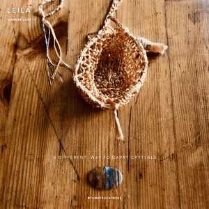 refugium gold trinket with crystal on table
