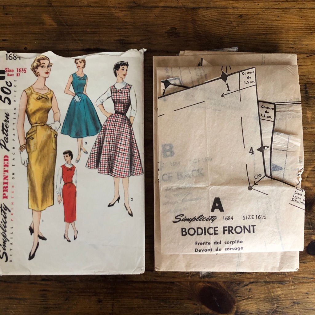 simplicity 1694 dress pattern pieces from 1956 shown for quality